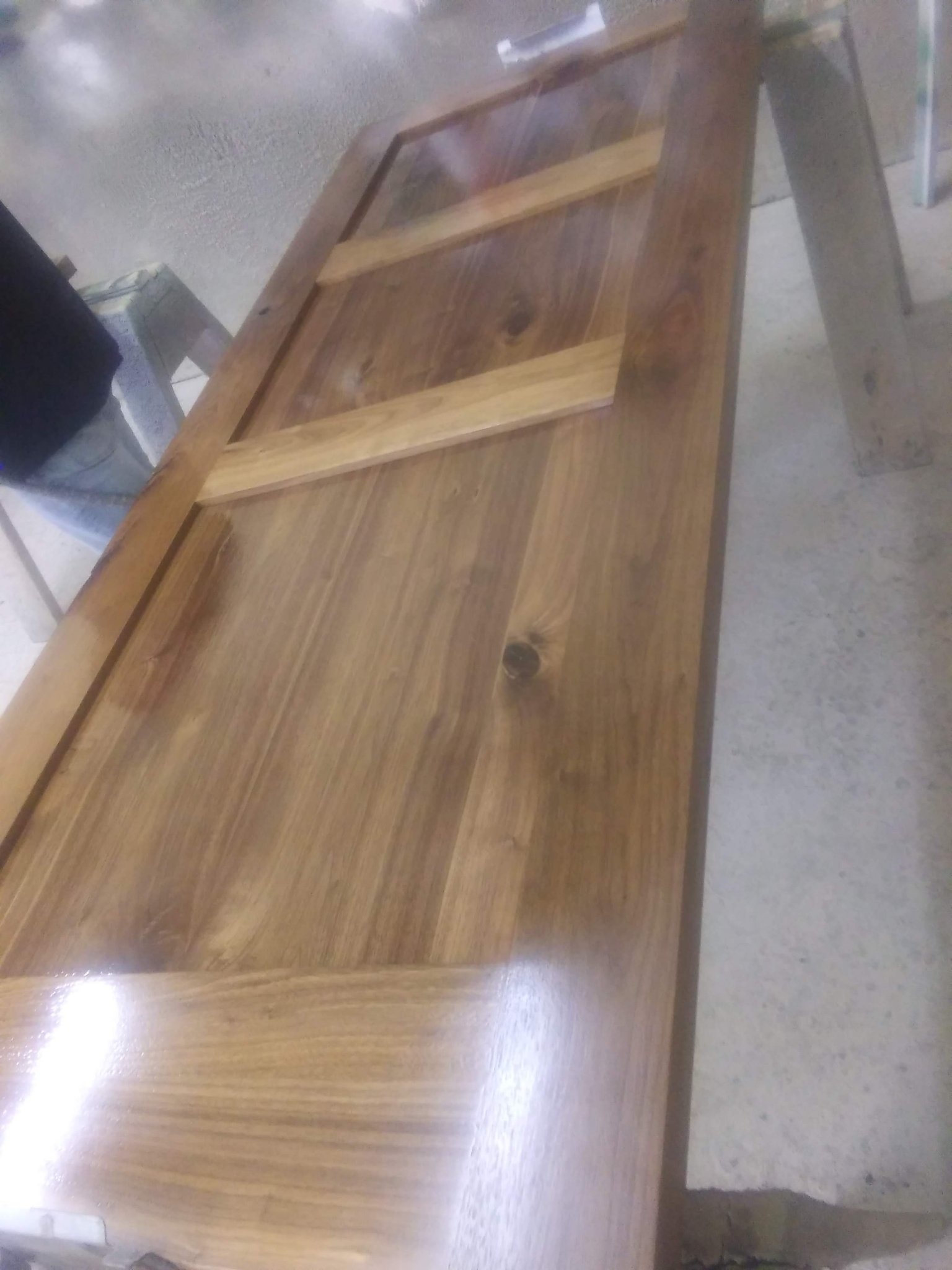 Wood door with a sprayed lacquer finish
