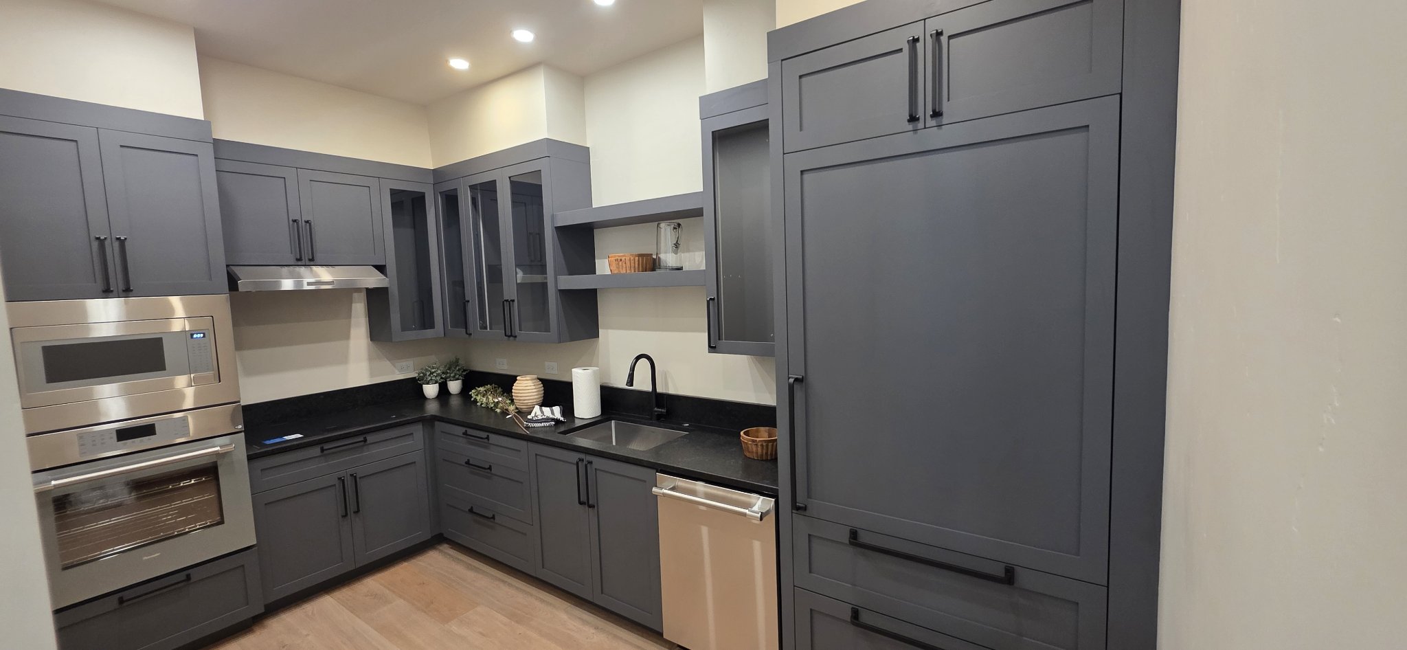 Laundry room cabinet installation with dark gray shaker cabinets in Missoula
