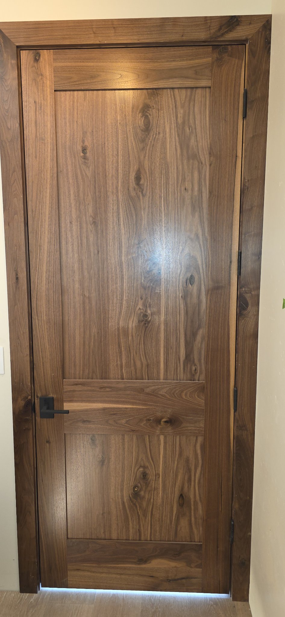 Walnut interior door with matching wood casing in Missoula